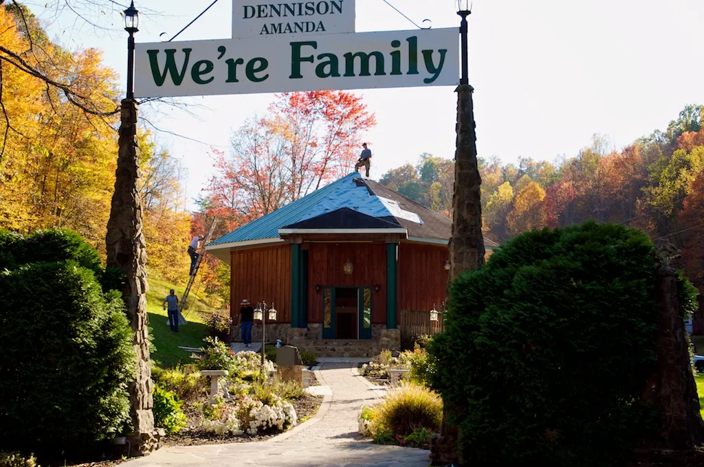 The We’re Family sign and pavilion surrounded by fall color